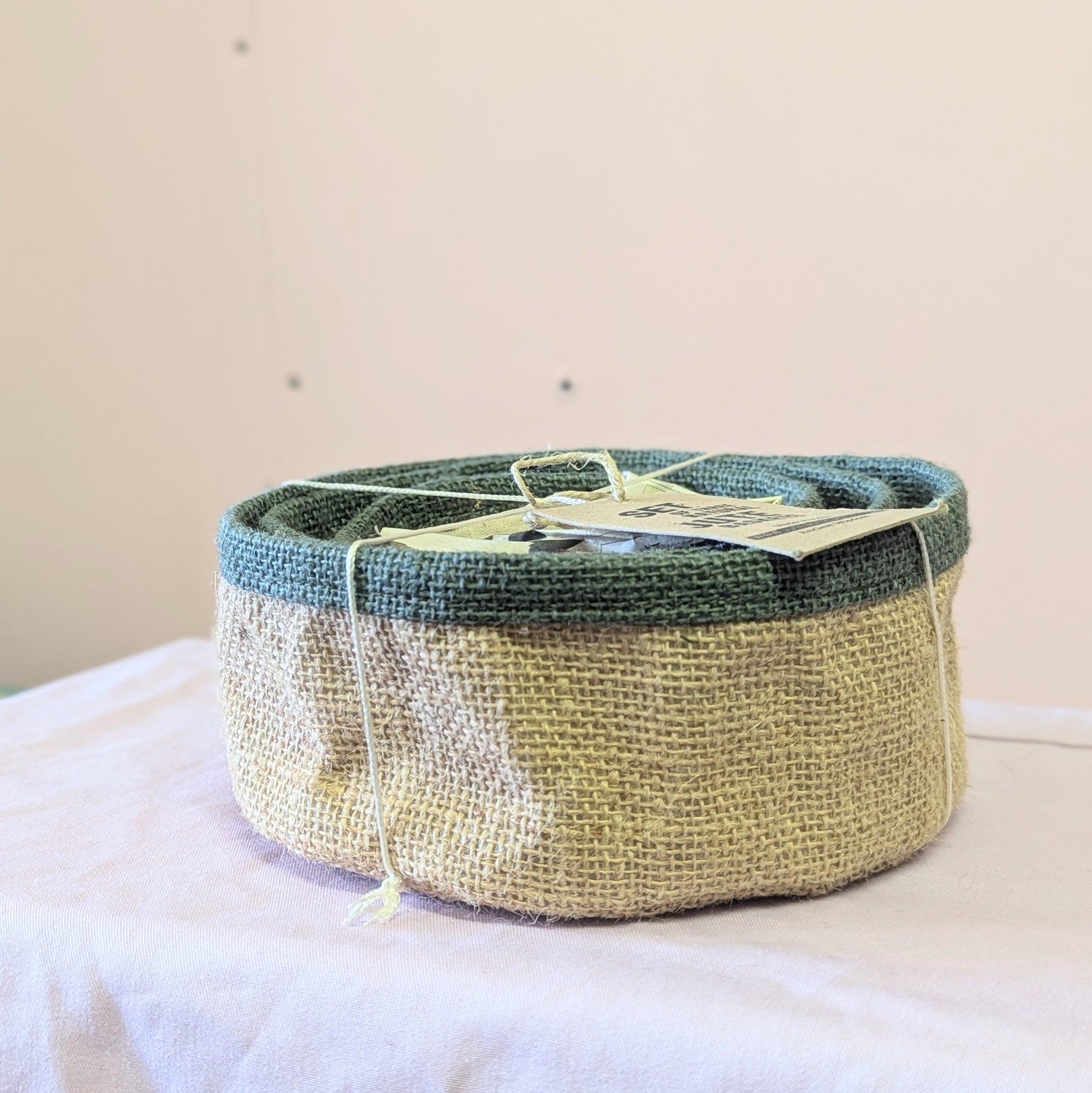 A set of 3 nesting baskets on a plain background for the Super Seconds Festival.