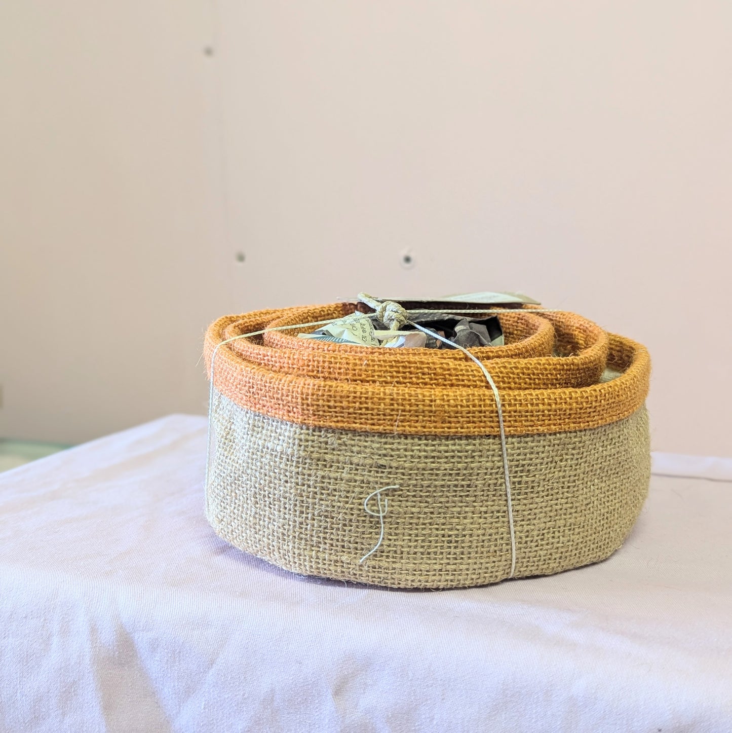 A set of 3 nesting baskets with an orange trim for the Super Seconds festival.