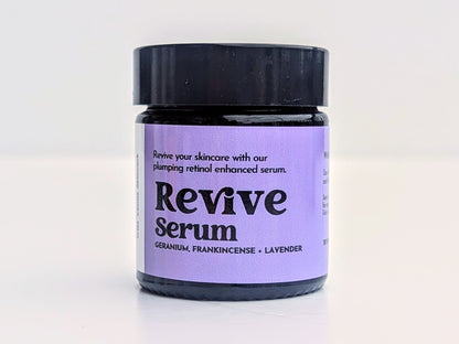 A pot of Revive serum is shown against a white background. 