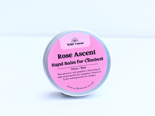A tin of Rose Ascent Hand Balm for Climbers. The tin is on its side with the label facing the viewer against a plain white background. 