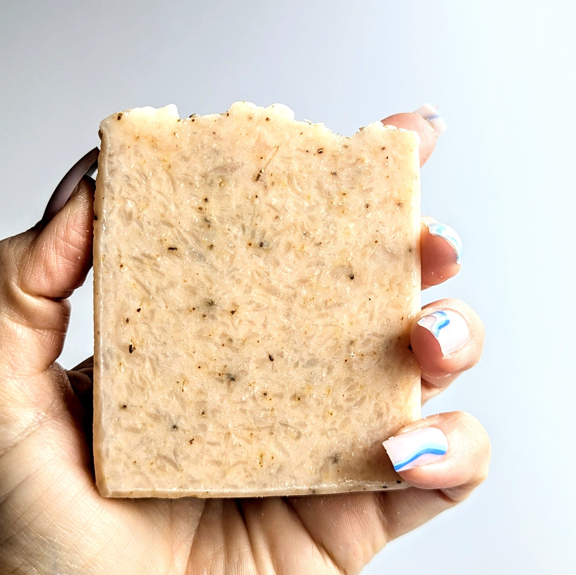 Clutching a naked bar of ginger and rosemary soap